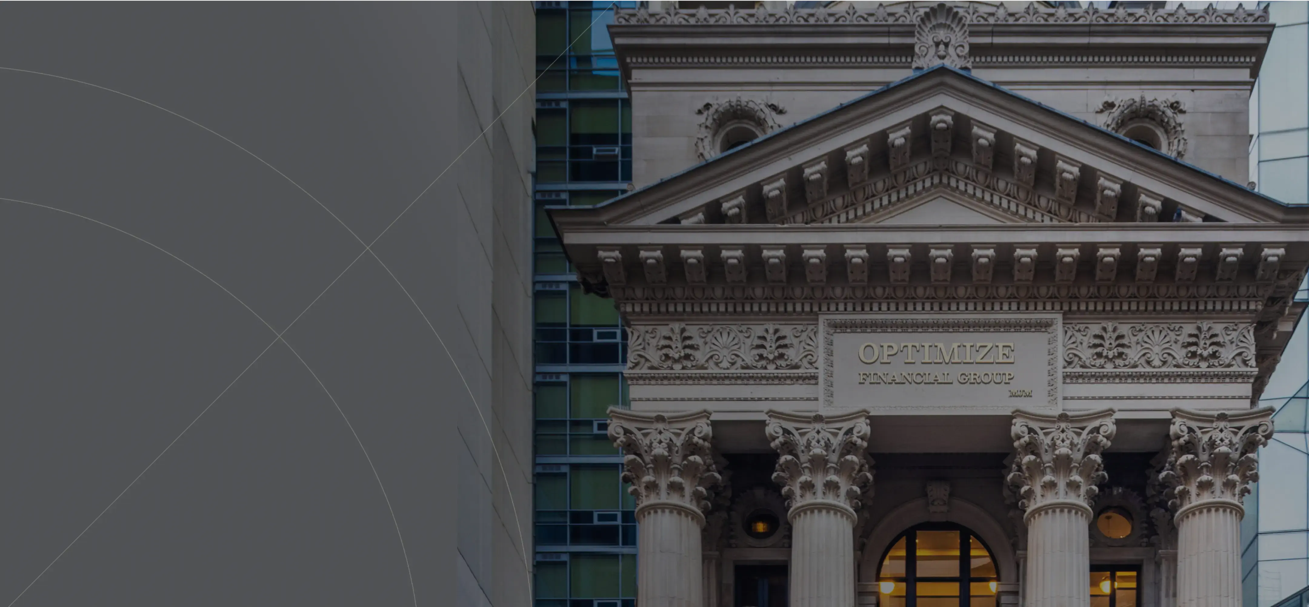 Close-up of a historic building façade with ornate stone carvings and the words ‘OPTIMIZE FINANCIAL GROUP’ engraved above the entrance.